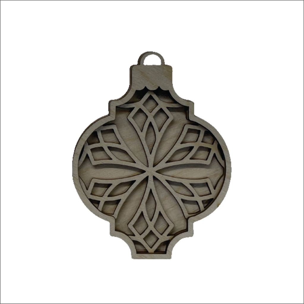 A wooden ornament with a floral design, featuring a symmetrical pattern of interlocking shapes.
