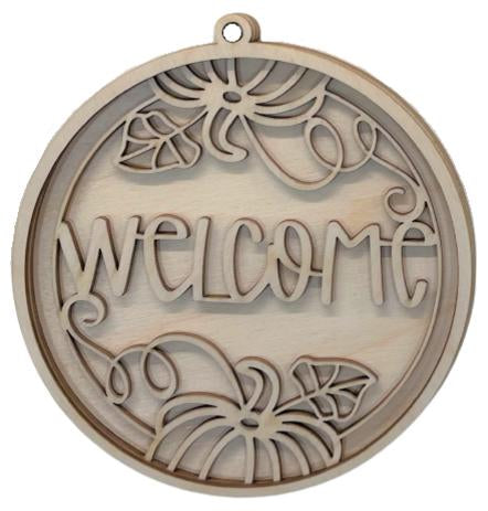 a wooden sign with the word "WELCOME" written on it.
